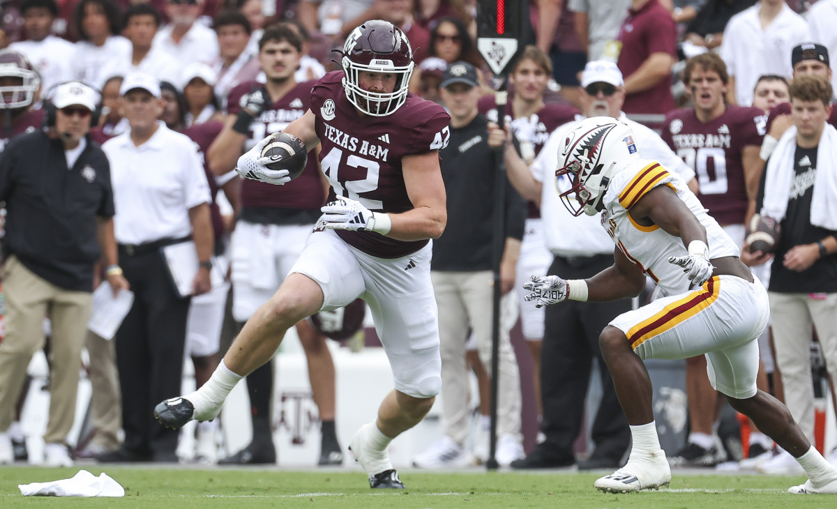 Sep 16, 2023; College Station, Texas, USA; Texas A&M Aggies tight end Max Wright (42) makes a reception as Louisiana Monroe Warhawks linebacker Travor Randle (4) defends during the first quarter at Kyle Field.